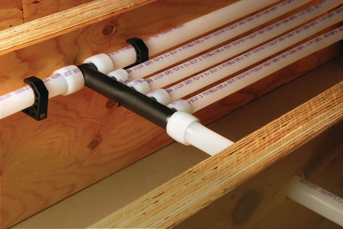 PEX-A multiport tee distributing water lines along joists – Replacing Your Tank for San Juan Capistrano, CA homes